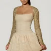 Aletta Minikleid mit verziertem Bubble-Saum in Gold Aletta Minikleid mit verziertem Bubble-Saum in Gold