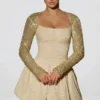 Aletta Minikleid mit verziertem Bubble-Saum in Gold Aletta Minikleid mit verziertem Bubble-Saum in Gold