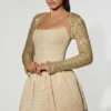 Aletta Minikleid mit verziertem Bubble-Saum in Gold Aletta Minikleid mit verziertem Bubble-Saum in Gold