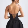 Anahita Schnür-Mikro-Minikleid mit Bubble-Saum und Korsett in Schwarz Anahita Schnür-Mikro-Minikleid mit Bubble-Saum und Korsett in Schwarz