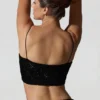 Ariana Oberteil mit Cut-outs und Verzierungen in Schwarz Ariana Oberteil mit Cut-outs und Verzierungen in Schwarz