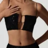 Ariana Oberteil mit Cut-outs und Verzierungen in Schwarz Ariana Oberteil mit Cut-outs und Verzierungen in Schwarz