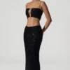 Ariana Oberteil mit Cut-outs und Verzierungen in Schwarz Ariana Oberteil mit Cut-outs und Verzierungen in Schwarz
