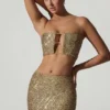 Ariana Verziertes Crop-Top mit Cut-outs in Gold Ariana Verziertes Crop-Top mit Cut-outs in Gold