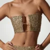 Ariana Verziertes Crop-Top mit Cut-outs in Gold Ariana Verziertes Crop-Top mit Cut-outs in Gold