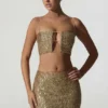 Ariana Verziertes Crop-Top mit Cut-outs in Gold Ariana Verziertes Crop-Top mit Cut-outs in Gold