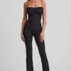Arlena Jumpsuit mit Schleifendetail und ausgestellter Passform aus Spitze in Schwarz