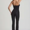 Arlena Jumpsuit mit Schleifendetail und ausgestellter Passform aus Spitze in Schwarz