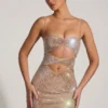 Ayleen Minikleid mit Verzierungen und Cut-outs in Mandel Ayleen Minikleid mit Verzierungen und Cut-outs in Mandel
