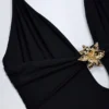 Bahari Cut-Out-Badeanzug mit Metallverzierung in Schwarz Bahari Cut-Out-Badeanzug mit Metallverzierung in Schwarz