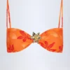 Baracoa Bikinioberteil mit Metallverzierung und Neckholder in Orange mit Orchideenprint Baracoa Bikinioberteil mit Metallverzierung und Neckholder in Orange mit Orchideenprint