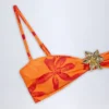 Baracoa Bikinioberteil mit Metallverzierung und Neckholder in Orange mit Orchideenprint Baracoa Bikinioberteil mit Metallverzierung und Neckholder in Orange mit Orchideenprint
