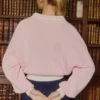 Baumwolljersey-Pullover mit V-Ausschnitt in Oversize-Passform in Puderrosa