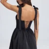 Bellamy Drapiertes Korsett-Minikleid in Schwarz Bellamy Drapiertes Korsett-Minikleid in Schwarz