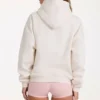 Übergroßer Hoodie mit Applikation in Elfenbein Übergroßer Hoodie mit Applikation in Elfenbein
