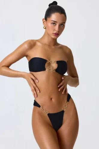 Sunny Isles Bandeau-Bikinioberteil mit Verzierungen und Cut-outs in Schwarz