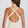 Body aus Stretch-Baumwolljersey mit überkreuztem Rücken in Creme Body aus Stretch-Baumwolljersey mit überkreuztem Rücken in Creme