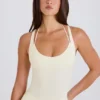 Body aus Stretch-Baumwolljersey mit überkreuztem Rücken in Creme Body aus Stretch-Baumwolljersey mit überkreuztem Rücken in Creme