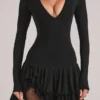 Cala Minikleid mit V-Ausschnitt und Rüschenrock in Schwarz Cala Minikleid mit V-Ausschnitt und Rüschenrock in Schwarz