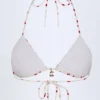 Calella Triangel-Bikinioberteil mit Charm-Detail im Kirschprint Calella Triangel-Bikinioberteil mit Charm-Detail im Kirschprint