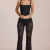 Calista Sheer Lace Mid-Rise Flared Trousers in Schwarz