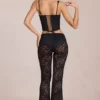 Calista Sheer Lace Mid-Rise Flared Trousers in Schwarz
