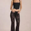 Calista Sheer Lace Mid-Rise Flared Trousers in Schwarz