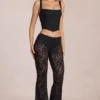 Calista Sheer Lace Mid-Rise Flared Trousers in Schwarz