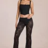 Calista Sheer Lace Mid-Rise Flared Trousers in Schwarz