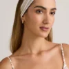 Candy Modal-Stirnband mit Rippmuster in rosa-gelben Streifen Candy Modal-Stirnband mit Rippmuster in rosa-gelben Streifen