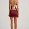 Carola Satin-Minirock mit Schleifenverzierung und niedriger Leibhöhe in Weinrot Carola Satin-Minirock mit Schleifenverzierung und niedriger Leibhöhe in Weinrot