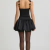 Cirilla Minikleid mit Rüschen und Schleife am Bubble-Saum in Schwarz Cirilla Minikleid mit Rüschen und Schleife am Bubble-Saum in Schwarz
