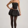 Clemmy Minirock mit Bubble-Saum und mittlerer Leibhöhe in Schwarz Clemmy Minirock mit Bubble-Saum und mittlerer Leibhöhe in Schwarz