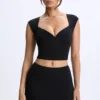 Cora Modal-Oberteil mit Rüschen und Flügelärmeln in Schwarz Cora Modal-Oberteil mit Rüschen und Flügelärmeln in Schwarz