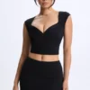 Cora Modal-Oberteil mit Rüschen und Flügelärmeln in Schwarz Cora Modal-Oberteil mit Rüschen und Flügelärmeln in Schwarz