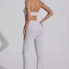 Coralena Jumpsuit mit Verzierungen und Cut-outs in Weiß