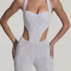 Coralena Jumpsuit mit Verzierungen und Cut-outs in Weiß