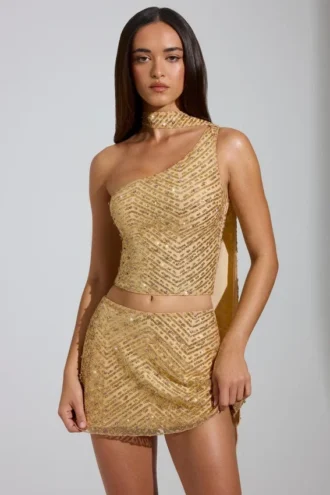 Cosette – Verziertes, asymmetrisches Oberteil mit Schaldetail in Gold