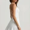 Daria Minikleid mit Schnürung und tiefem Taillenbund in Weiß Daria Minikleid mit Schnürung und tiefem Taillenbund in Weiß