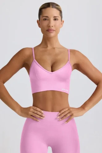 Define Luxe Sport-BH mit V-Ausschnitt in Bubblegum-Pink