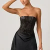 Eden – Verziertes, drapiertes, trägerloses A-Linien-Minikleid in Schwarz Eden – Verziertes, drapiertes, trägerloses A-Linien-Minikleid in Schwarz