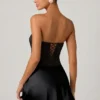 Eden – Verziertes, drapiertes, trägerloses A-Linien-Minikleid in Schwarz Eden – Verziertes, drapiertes, trägerloses A-Linien-Minikleid in Schwarz