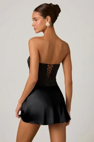 Eden – Verziertes, drapiertes, trägerloses A-Linien-Minikleid in Schwarz