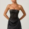 Eden – Verziertes, drapiertes, trägerloses A-Linien-Minikleid in Schwarz Eden – Verziertes, drapiertes, trägerloses A-Linien-Minikleid in Schwarz