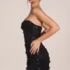Edita Minikleid mit verzierten Applikationen und Herzausschnitt in Schwarz Edita Minikleid mit verzierten Applikationen und Herzausschnitt in Schwarz