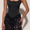 Eira Satin-Korsett-Minikleid mit verziertem Rock in Schwarz-Lila Eira Satin-Korsett-Minikleid mit verziertem Rock in Schwarz-Lila