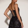 Eira Satin-Korsett-Minikleid mit verziertem Rock in Schwarz-Lila Eira Satin-Korsett-Minikleid mit verziertem Rock in Schwarz-Lila