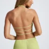 Elania Oberteil mit offenem Rücken und asymmetrischem Neckholder in Olivgrün Elania Oberteil mit offenem Rücken und asymmetrischem Neckholder in Olivgrün