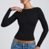Elli Modal-Oberteil mit hohem Kragen, langen Ärmeln und offenem Rücken in Schwarz Elli Modal-Oberteil mit hohem Kragen, langen Ärmeln und offenem Rücken in Schwarz