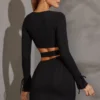 Enya Langarm-Minikleid mit Cut-outs in Schwarz Enya Langarm-Minikleid mit Cut-outs in Schwarz